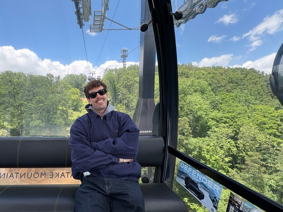 Pablo Carmona smiles during a cable car ride